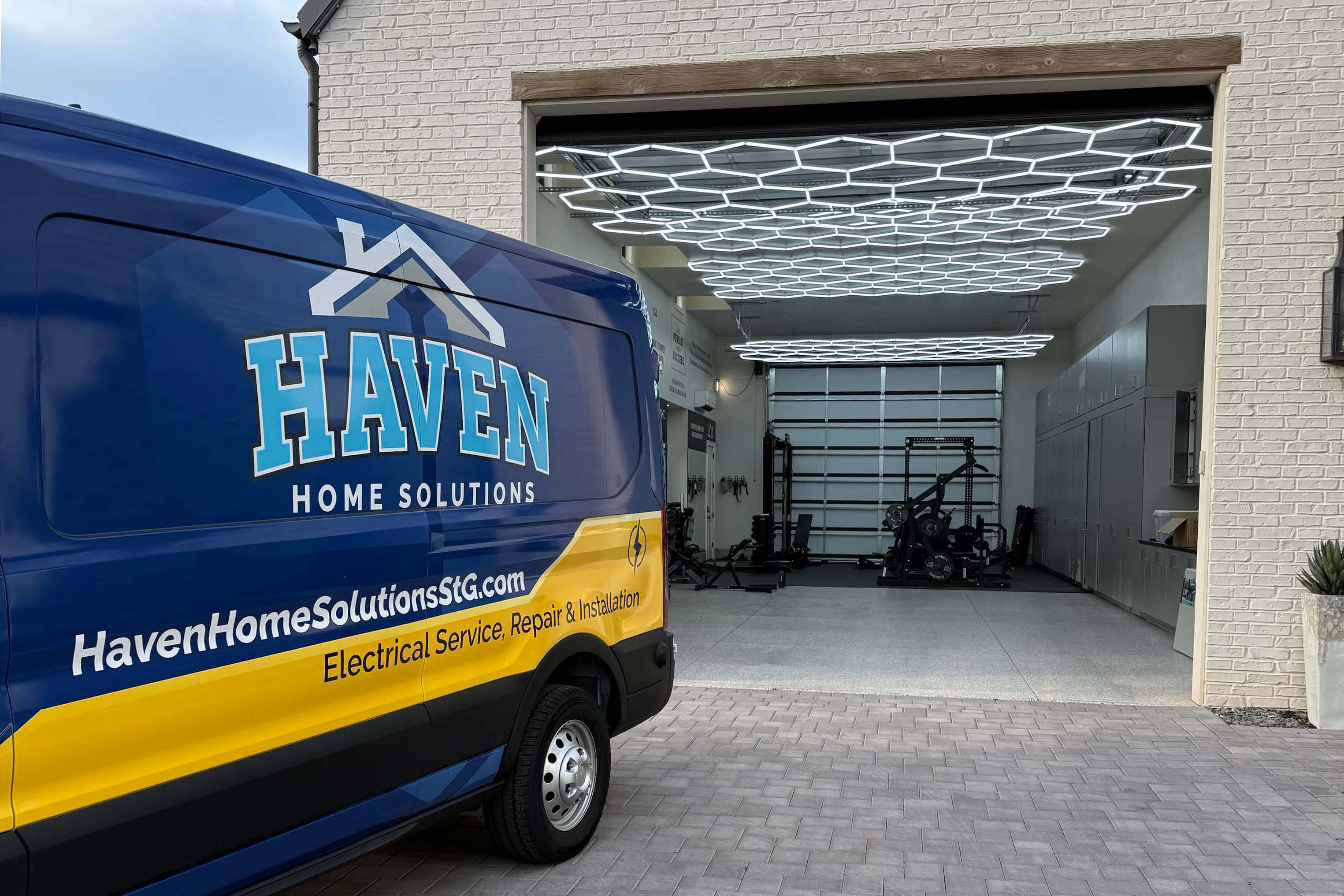 Haven Home Solutions truck outside of a garage